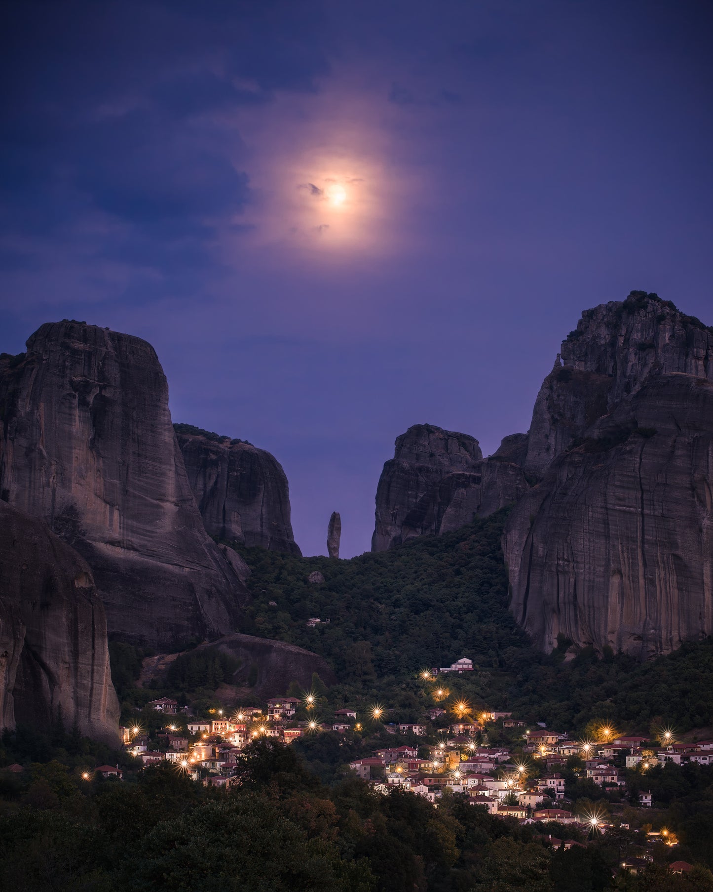 Image Title: The Night Watch Photographer: Marcus Danz Location: Kastraki, Greece Image description: Supported by the full moon, an imposing rock needle seems to watch over the Greek village of Kastraki. High quality Fine Art print up to 36 inch / around 90 centimeters on Hahnemühle paper available.
