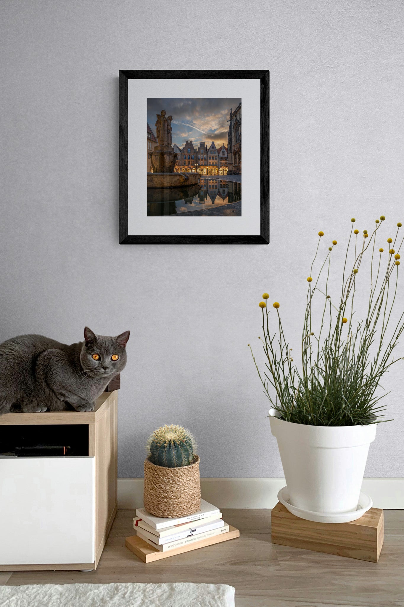 Image Title: Well, it's Münster! Photographer: Marcus Danz Location: Münster, Germany Image description: Münster's ”Prinzipalmarkt“ is reflected in the water of a fountain during sunset. High quality Fine Art print up to 36 inch / around 90 centimeters on Hahnemühle paper available. Small variant in living room.