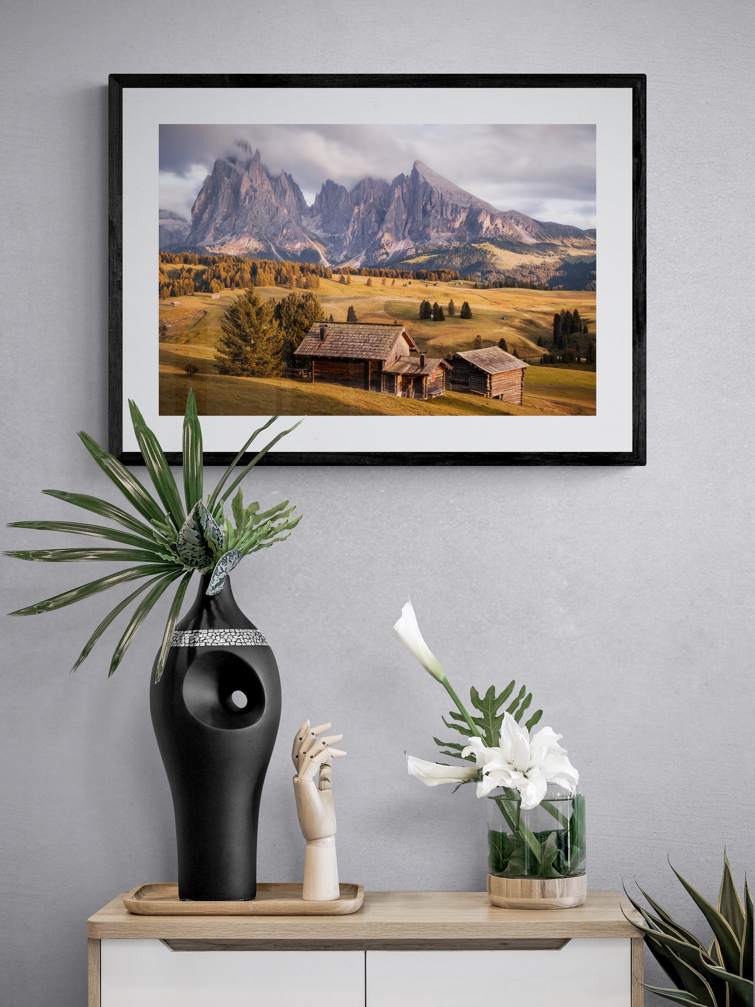 Image Title: A Tyrol Tidbit Photographer: Marcus Danz Location: Alpe di Siusi, Italy Image description: While increasingly dense clouds pass by the peaks of the mighty Sassolungo group, the pasture catches the warm light of the soon-to-set sun one more time. High quality Fine Art print up to 36 inch / around 90 centimeters on Hahnemühle paper available. Medium variant over sideboard.