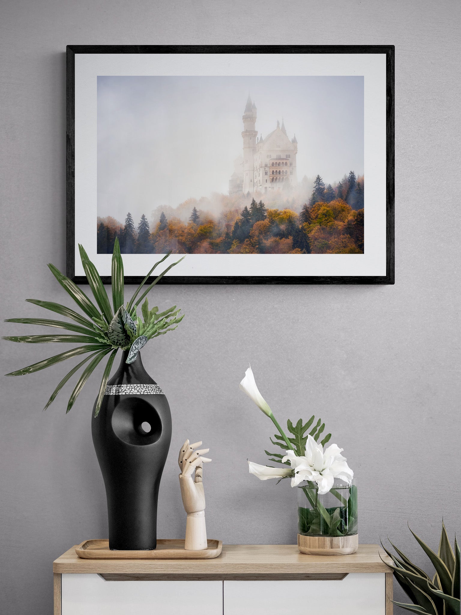 Image Title: Autumn under Neuschwanstein Photographer: Marcus Danz Location: Schwangau, Germany Image description: Shrouded in mist, Neuschwanstein Castle towers majestically above the autumnly colored woods. High quality Fine Art print up to 36 inch / around 90 centimeters on Hahnemühle paper available. Medium variant over sideboard.