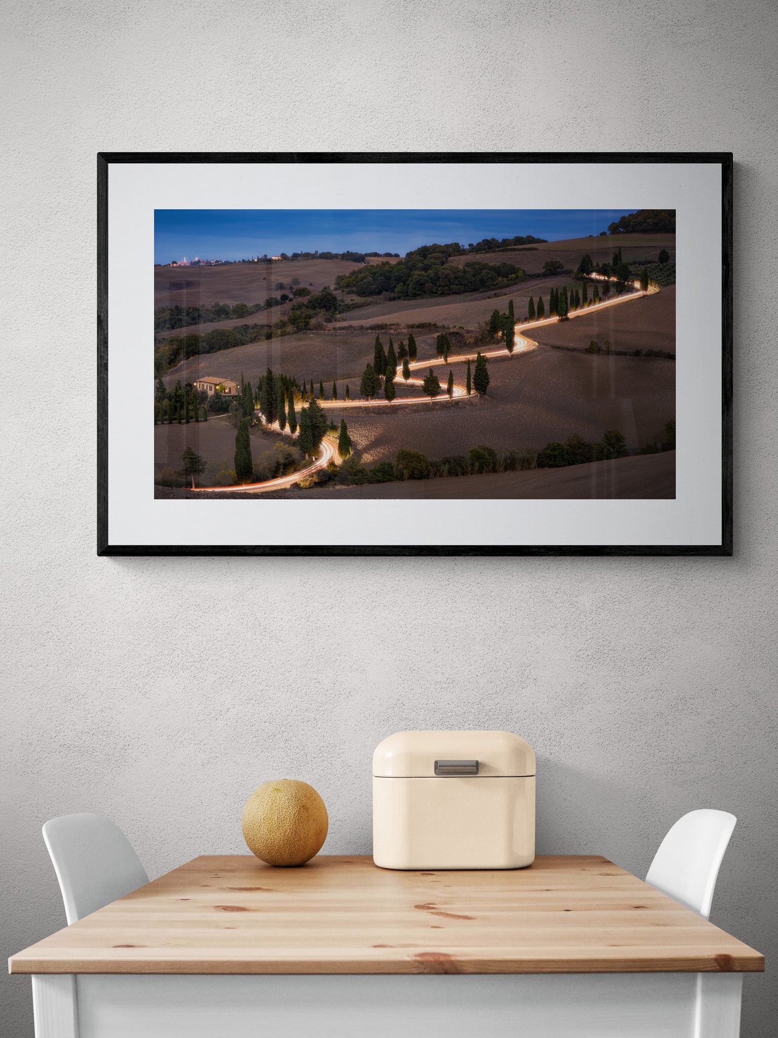 Image Title: Glowing Cypress Road Photographer: Marcus Danz Location: Monticchiello, Italy Image description: Car lights trace the winding course of one of the most beautiful cypress roads in Tuscany, Italy. High quality Fine Art print up to 36 inch / around 90 centimeters on Hahnemühle paper available. Large variant over kitchen table.