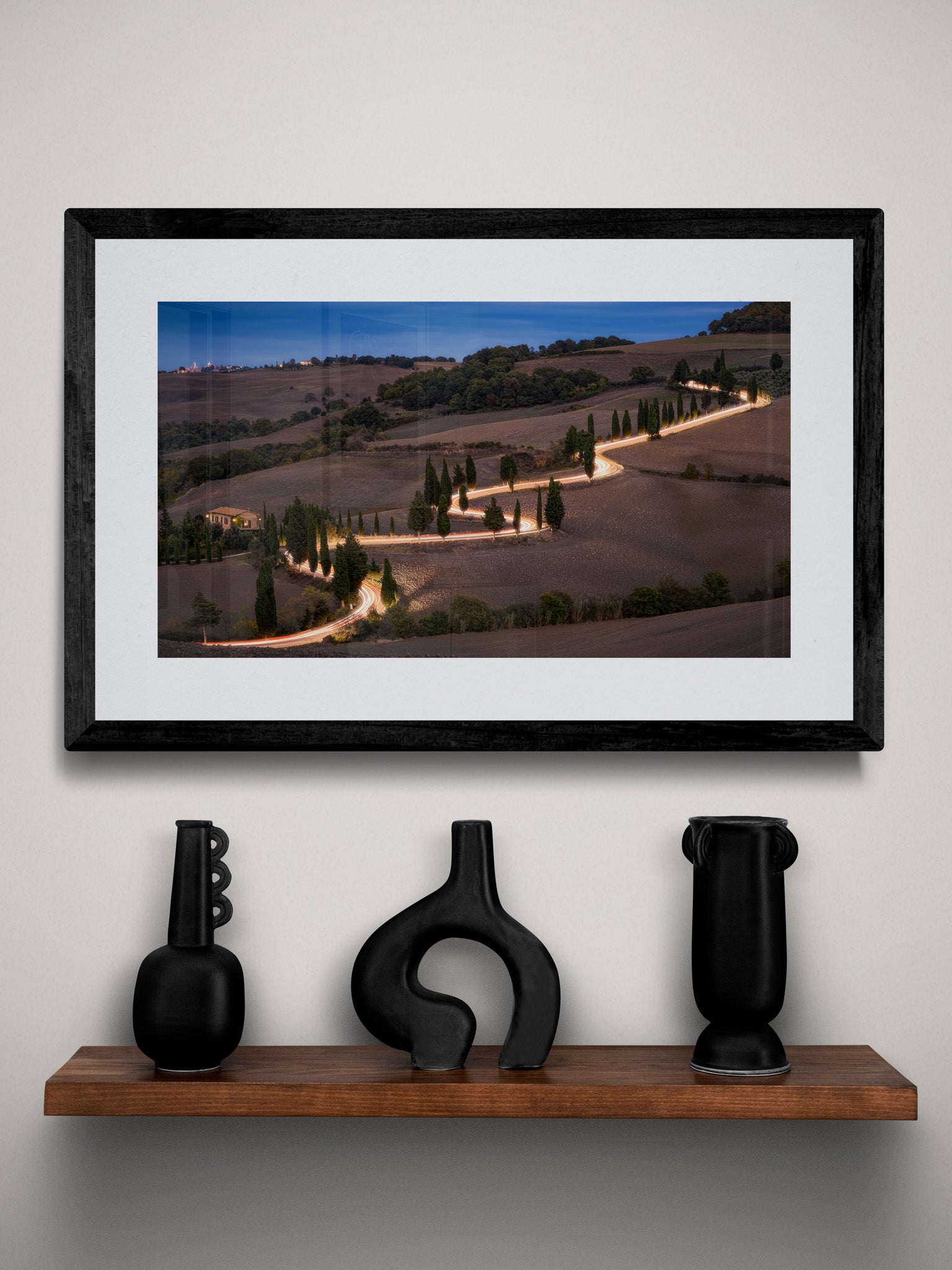 Image Title: Glowing Cypress Road Photographer: Marcus Danz Location: Monticchiello, Italy Image description: Car lights trace the winding course of one of the most beautiful cypress roads in Tuscany, Italy. High quality Fine Art print up to 36 inch / around 90 centimeters on Hahnemühle paper available. Small variant over shelf.