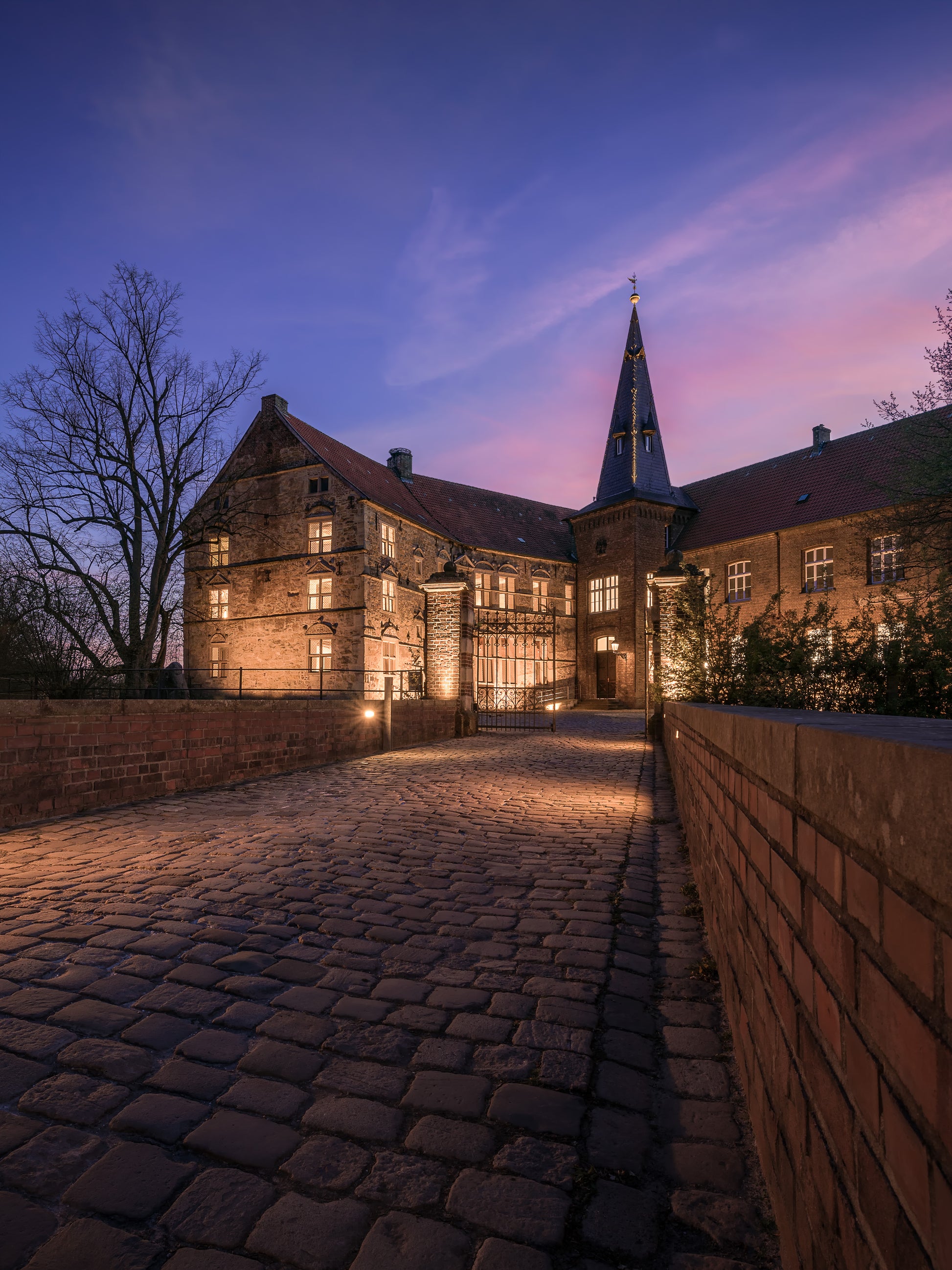 Image Title: Light the Castle Photographer: Marcus Danz Location: Lüdinghausen, Germany Image description: Lüdinghausen Castle is beautifully illuminated on this mild spring evening. High quality Fine Art print up to 36 inch / around 90 centimeters on Hahnemühle paper available.