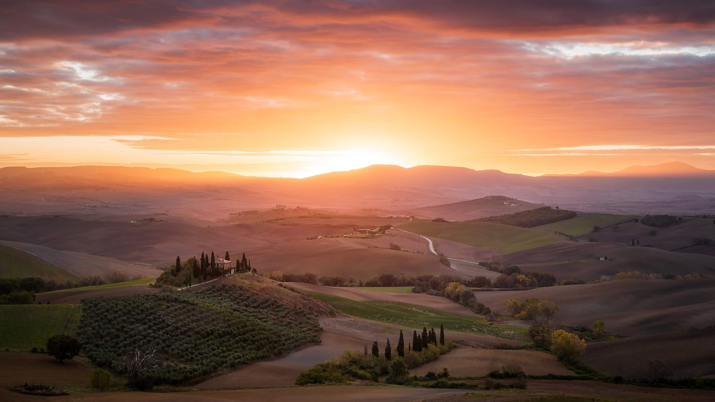 Image Title: Morning Glory Photographer: Marcus Danz Location: Val D'orcia, Italy Image description: The rolling hills of Tuscany and Podere Belvedere are caressed by the soft light of the morning sky. High quality Fine Art print up to 36 inch / around 90 centimeters on Hahnemühle paper available.