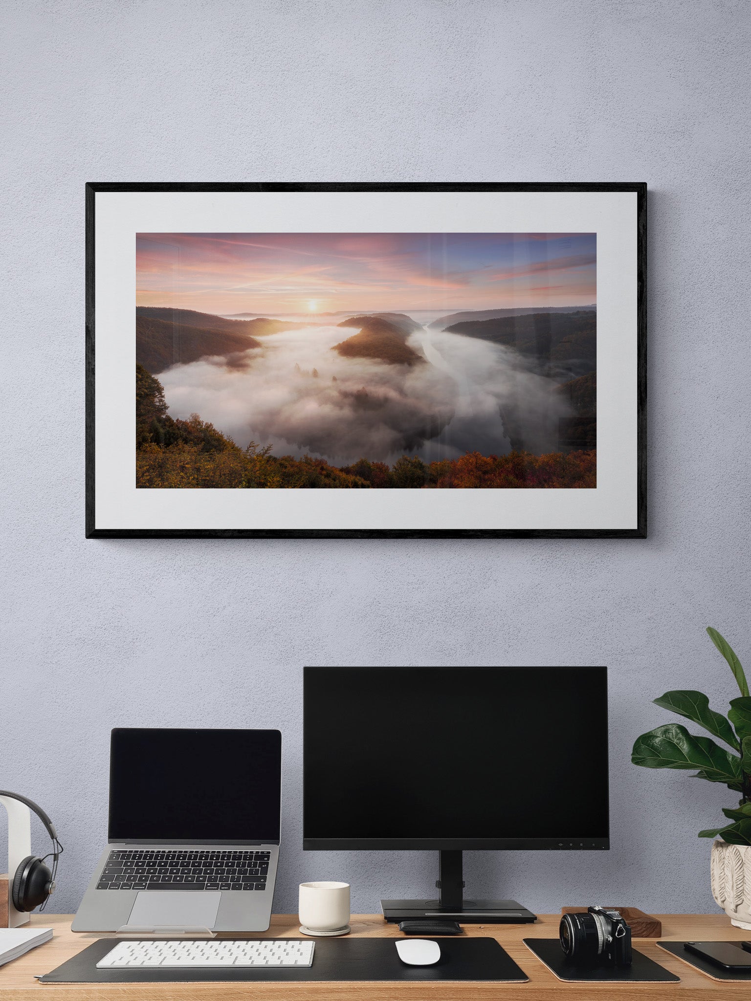 Image Title: The foggy Loop Photographer: Marcus Danz Location: Mettlach, Germany Image description: Mysterious morning fog drifts silently through Mettlach’s Saar loop, partly lit by the warm light of the rising sun. High quality Fine Art print up to 36 inch / around 90 centimeters on Hahnemühle paper available. Large variant over computer desk.