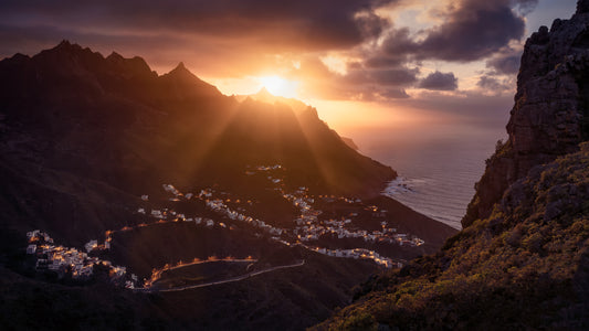 Image Title: The Taganana Twist Photographer: Marcus Danz Location: Tenerife, Spain Image description: Accompanied by the spectacular sunset at the peaks of the Anaga Mountains, the lights of the village of Taganana come to life. High quality Fine Art print up to 36 inch / around 90 centimeters on Hahnemühle paper available.