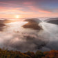 Image Title: The foggy Loop Photographer: Marcus Danz Location: Mettlach, Germany Image description: Mysterious morning fog drifts silently through Mettlach’s Saar loop, partly lit by the warm light of the rising sun. High quality Fine Art print up to 36 inch / around 90 centimeters on Hahnemühle paper available.