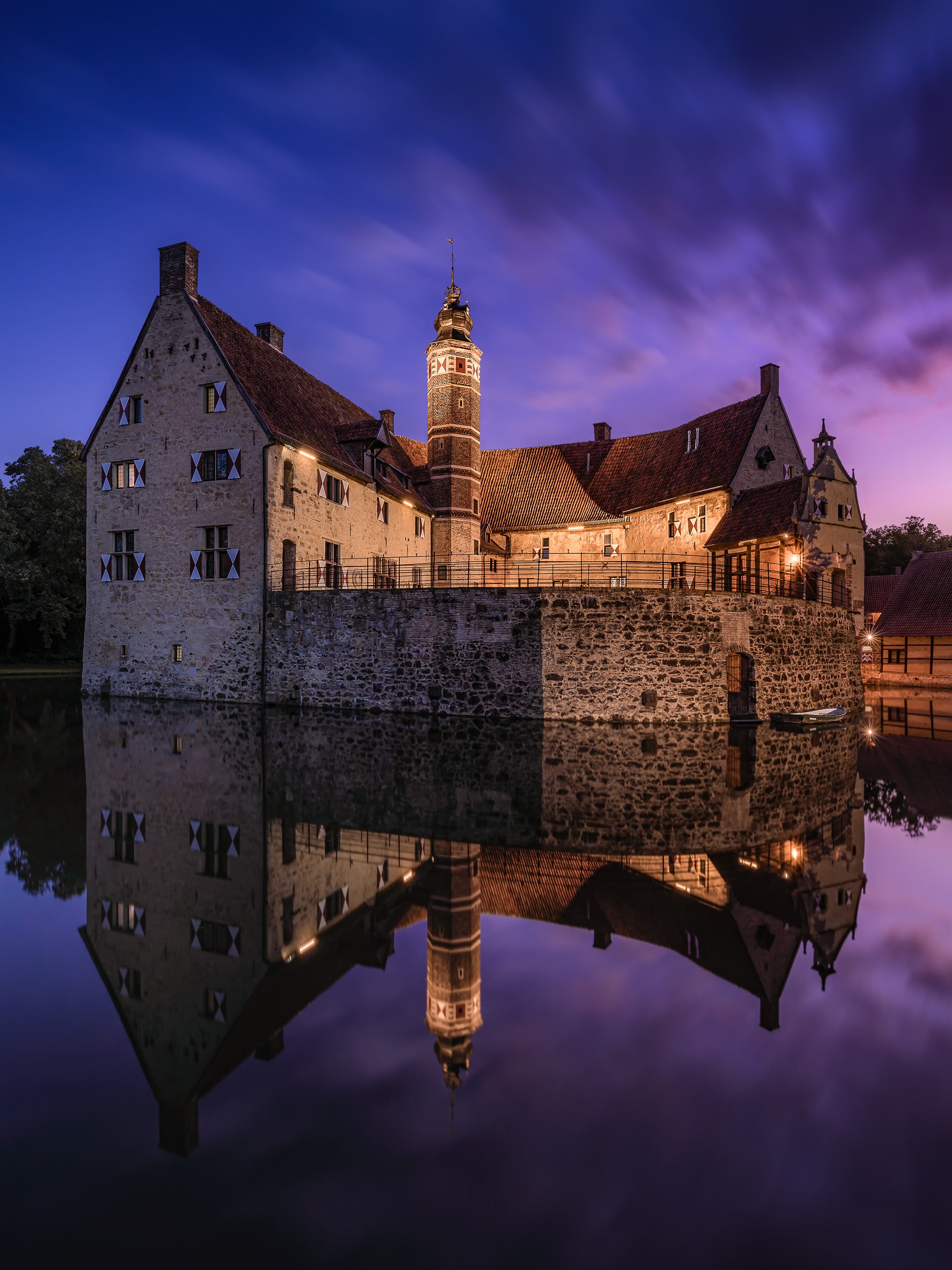 Image Title: Time flies by Photographer: Marcus Danz Location: Lüdinghausen, Germany Image description: Vischering Castle, my home town‘s medieval jewel, shines in all its beauty on this perfect summer evening shortly after sunset. High quality Fine Art print up to 36 inch / around 90 centimeters on Hahnemühle paper available.