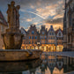 Image Title: Well, it's Münster!  Photographer: Marcus Danz Location: Münster, Germany Image description: Münster's ”Prinzipalmarkt“ is reflected in the water of a fountain during sunset. High quality Fine Art print up to 36 inch / around 90 centimeters on Hahnemühle paper available.