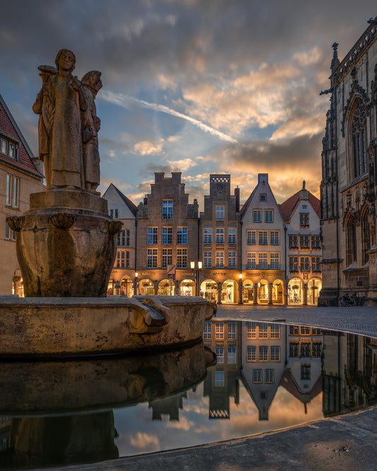 Image Title: Well, it's Münster!  Photographer: Marcus Danz Location: Münster, Germany Image description: Münster's ”Prinzipalmarkt“ is reflected in the water of a fountain during sunset. High quality Fine Art print up to 36 inch / around 90 centimeters on Hahnemühle paper available.